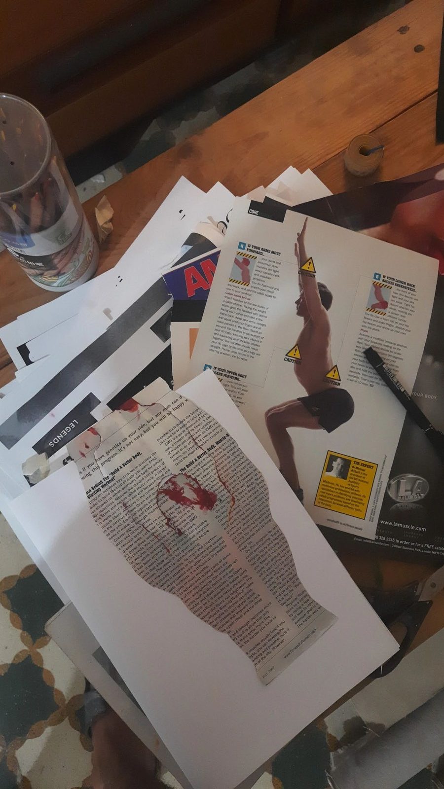 Working table with magazine pages and cutouts